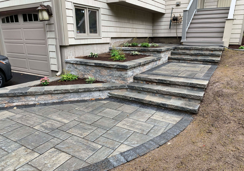 Multi-level paver patio with seating wall and steps