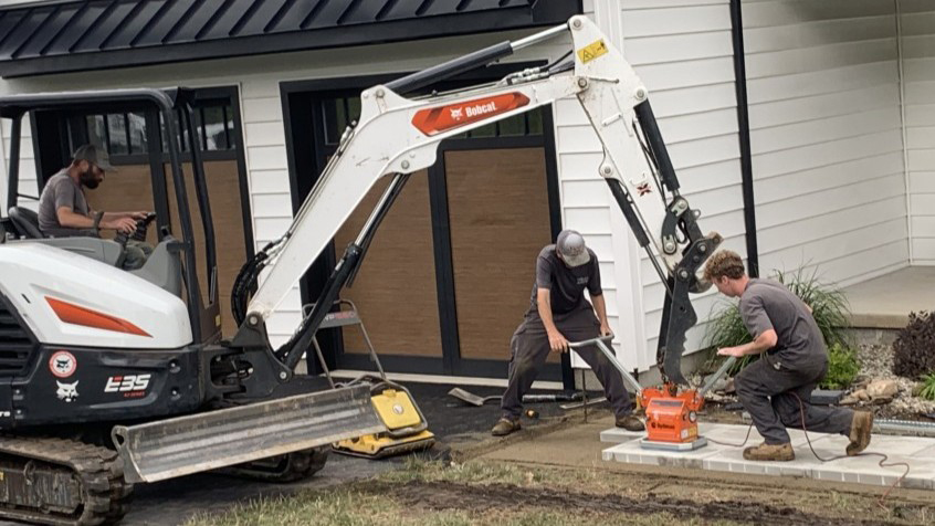 Tynic team with hardscape equipment